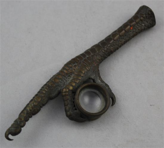 A Continental bronze loupe or magnifying glass, modelled as an eagles claw, 5.75in.